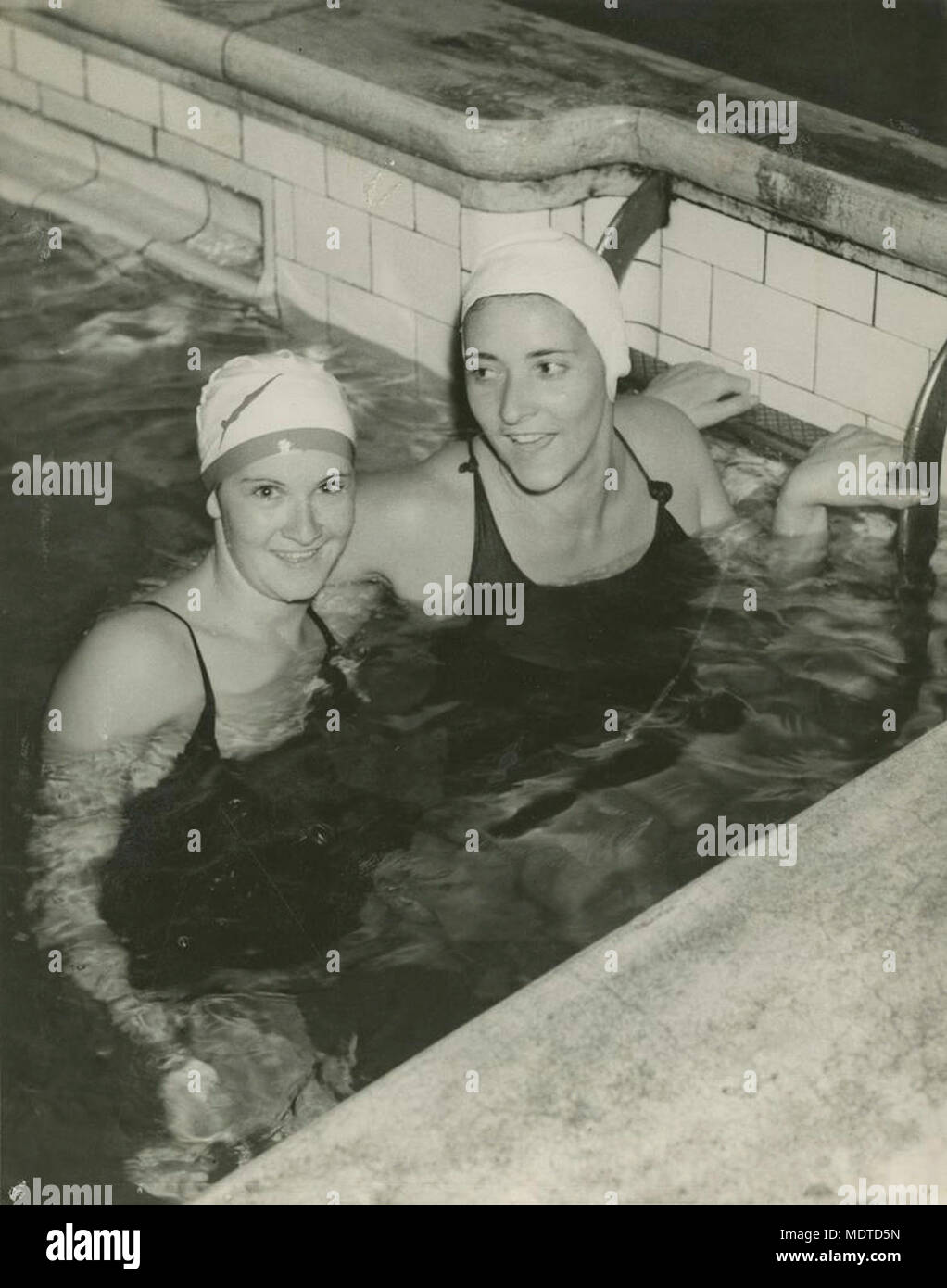 Two young ladies in the swimming pool, Brisbane. Location:  Brisbane, Queensland, Australia  Date:  Undated. Circa 1943 Stock Photo