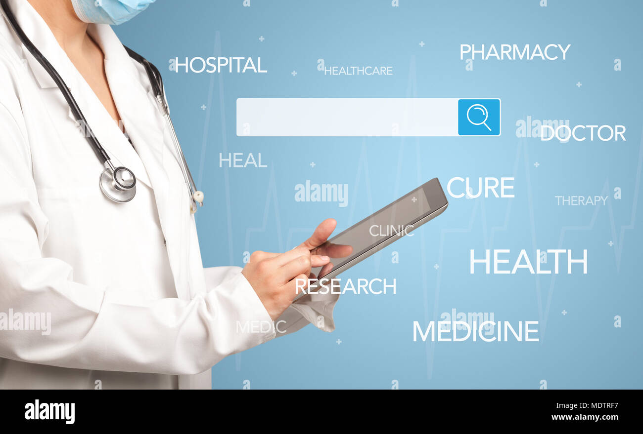 Female doctor holding tablet with blue background and search bar with ...