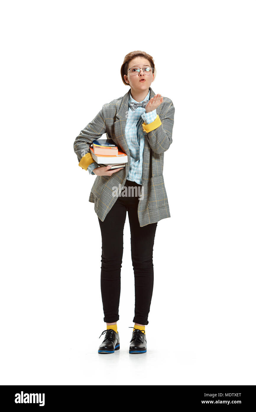 Full length portrait of a happy smiling female student holding books ...