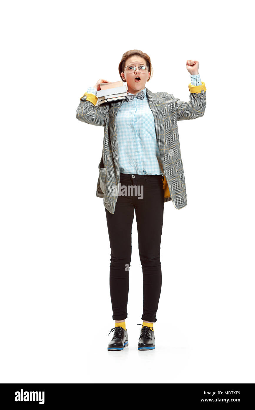 Full length portrait of a happy smiling female student holding books ...