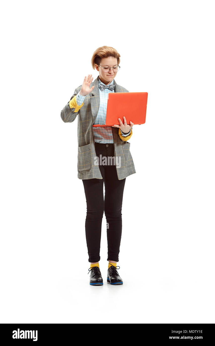 Full length portrait of a happy smiling female student holding notebook ...