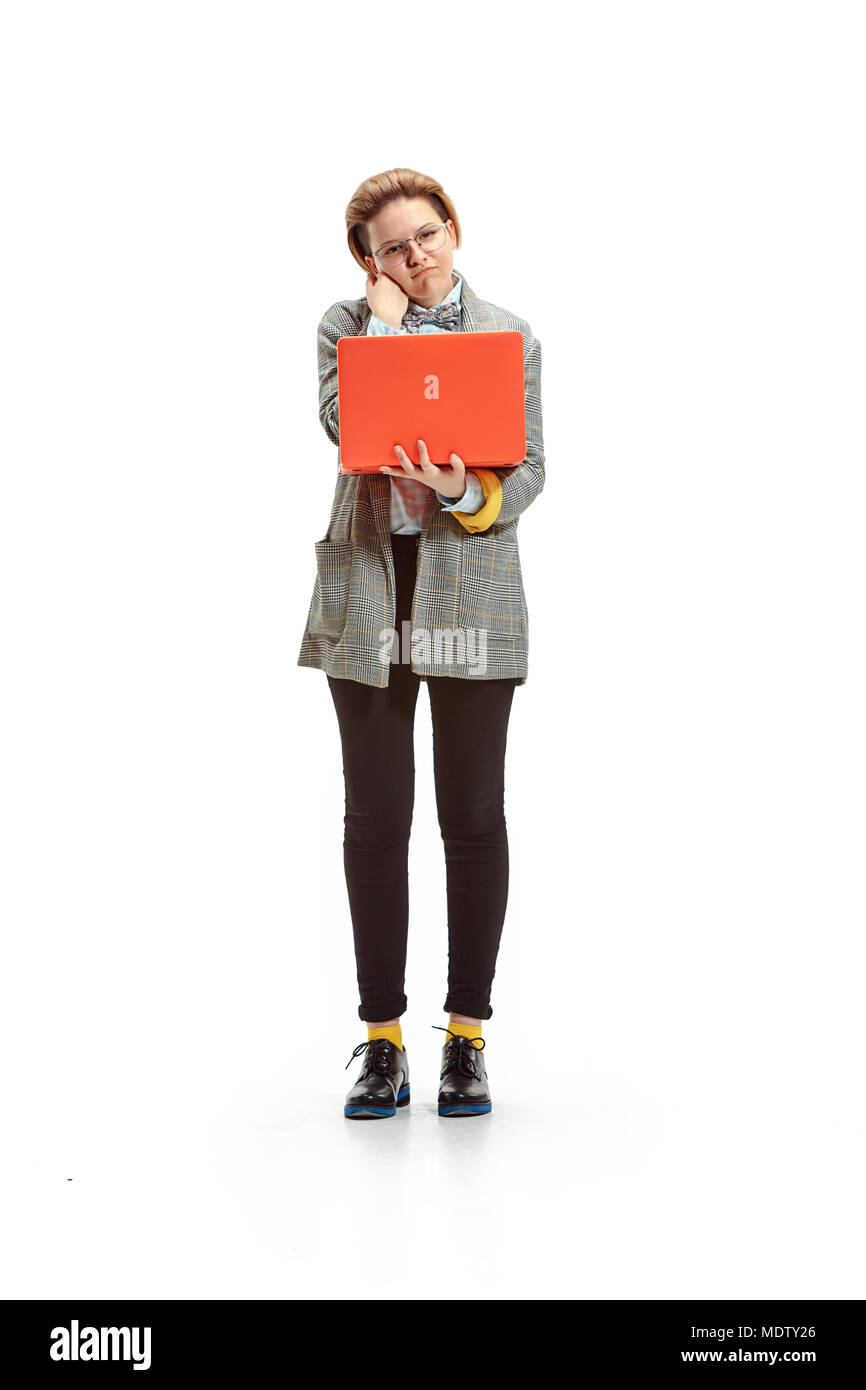 Full length portrait of a happy smiling female student holding notebook ...
