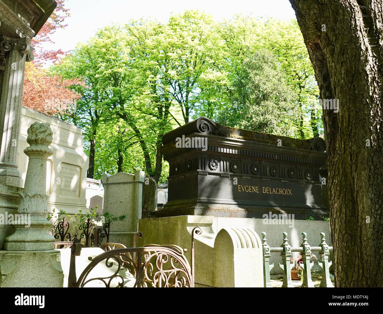 Tomb of Eugene Delacroix seen against spring foliage in Père Lachaise