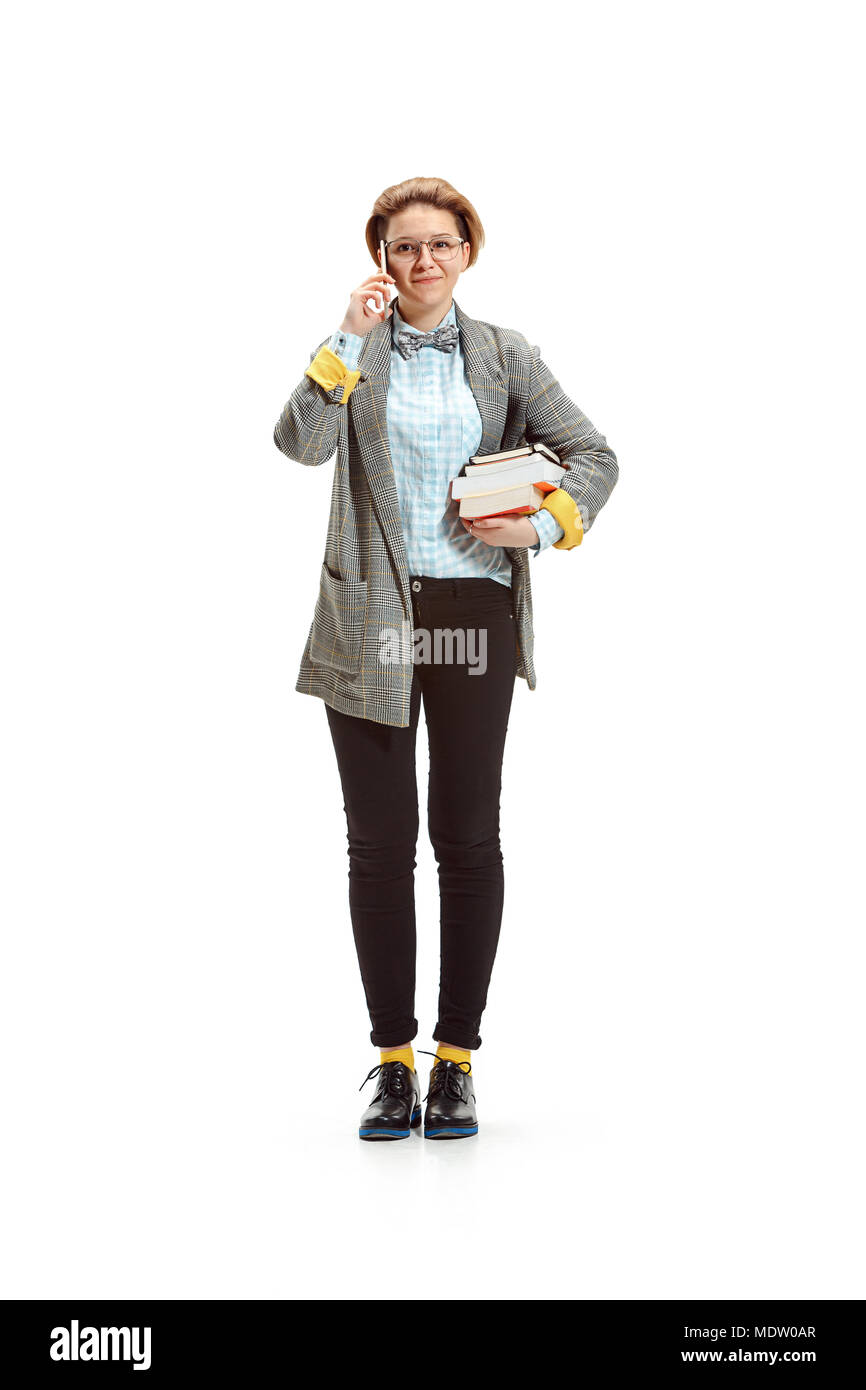 Full length portrait of a happy smiling female student holding books ...