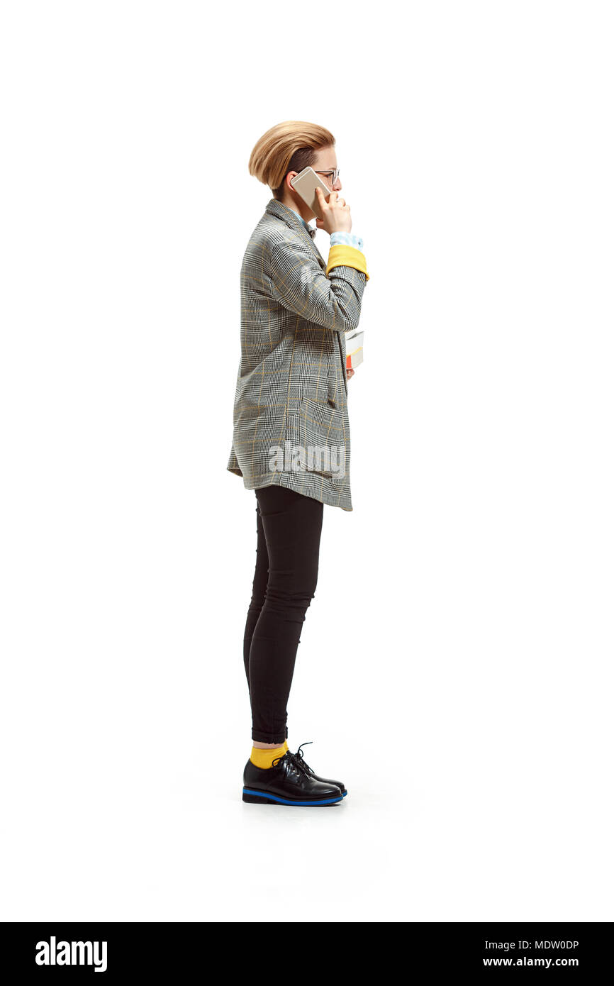 Full length portrait of a happy smiling female student holding books ...