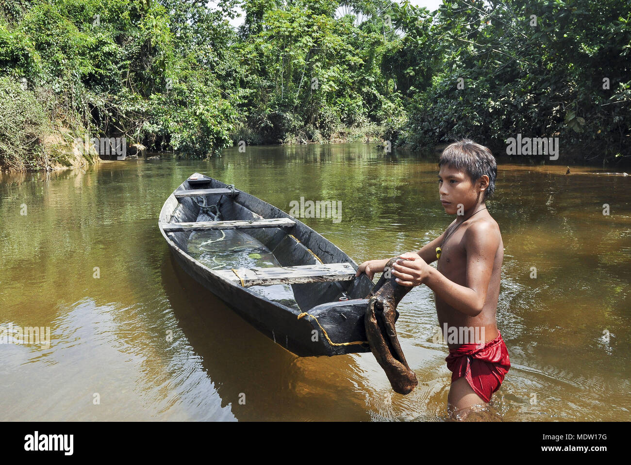 Yanomami and child in the Chestnut Canoe River - Village Station - Region of Marari Stock Photo