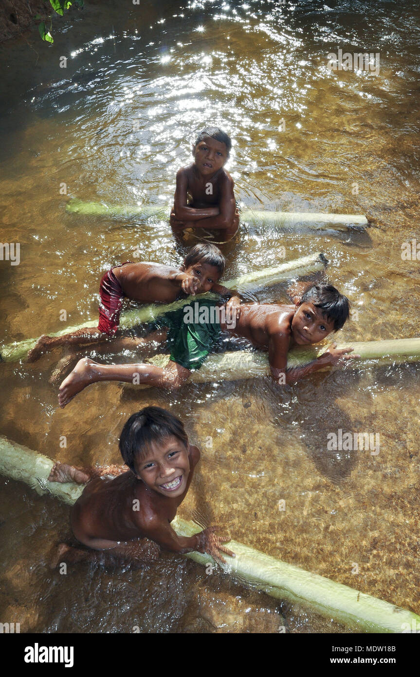 Yanomami children play in Igarapé Village of Chestnut - Region of Marari Stock Photo
