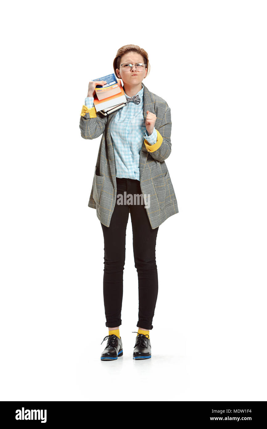 Full length portrait of a angry female student holding books isolated ...