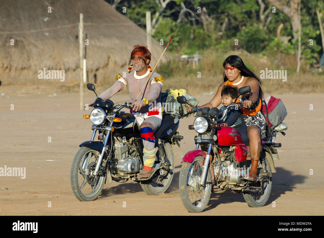 Couple and son ethnicity Waura motorcycle coming to the Village Jawari Aiha ethnicity Kalapalo Stock Photo