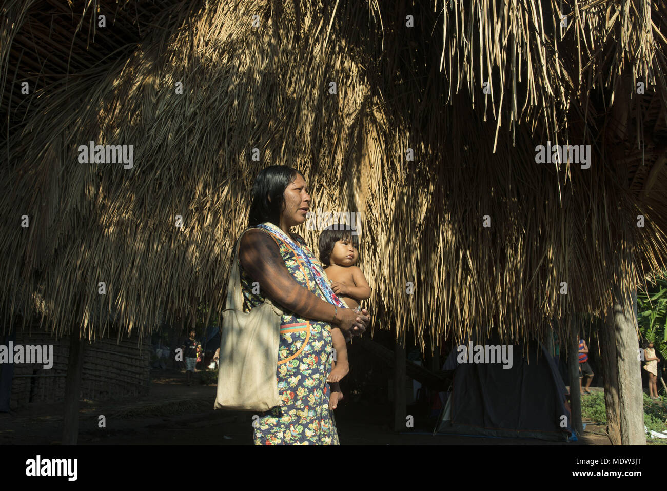 India Kayapo village of Moikarako with son on lap Stock Photo