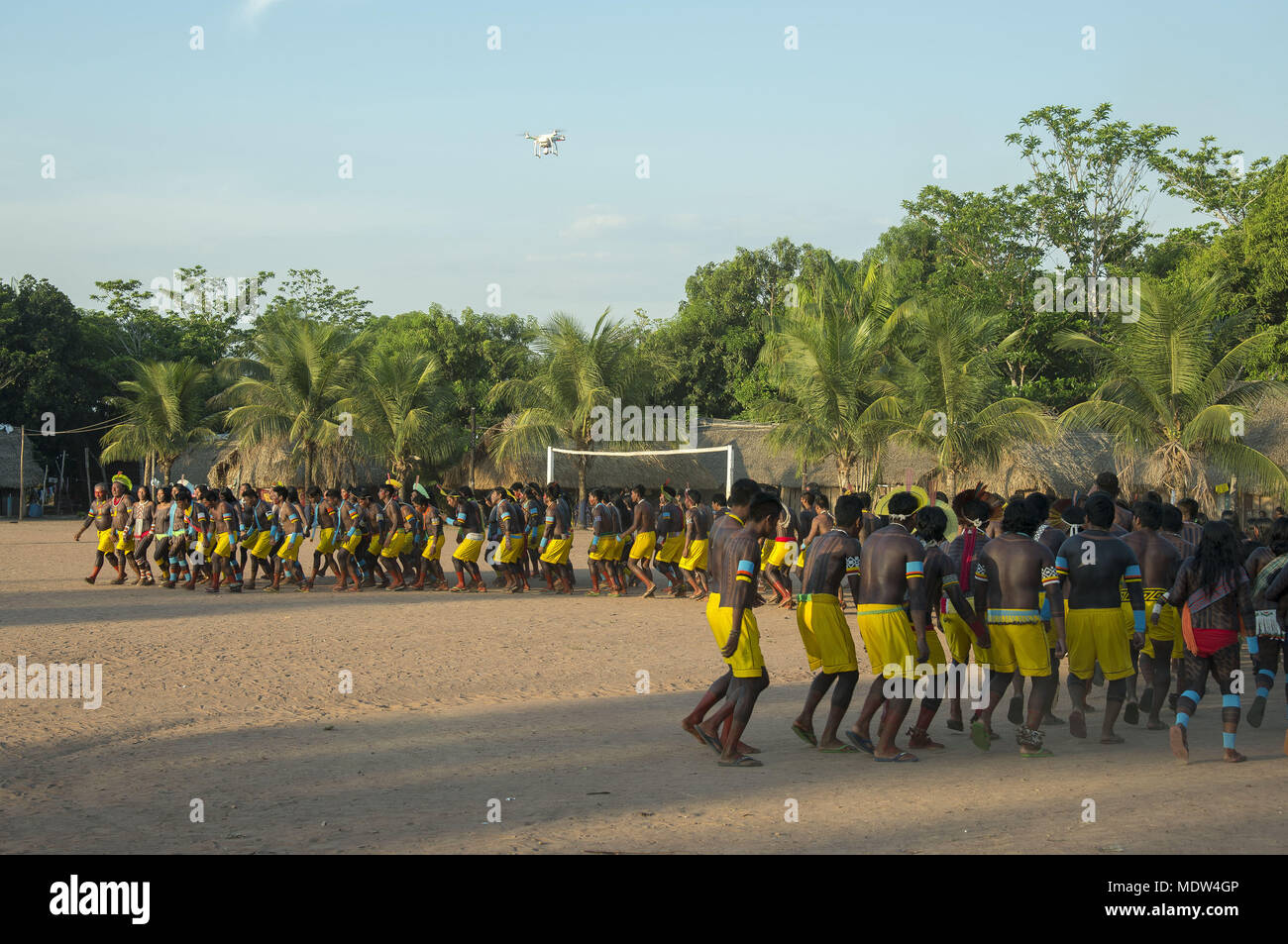 Kayapó Indians of the village Moikarako participate in the dance of cassava and drone capturing images Stock Photo