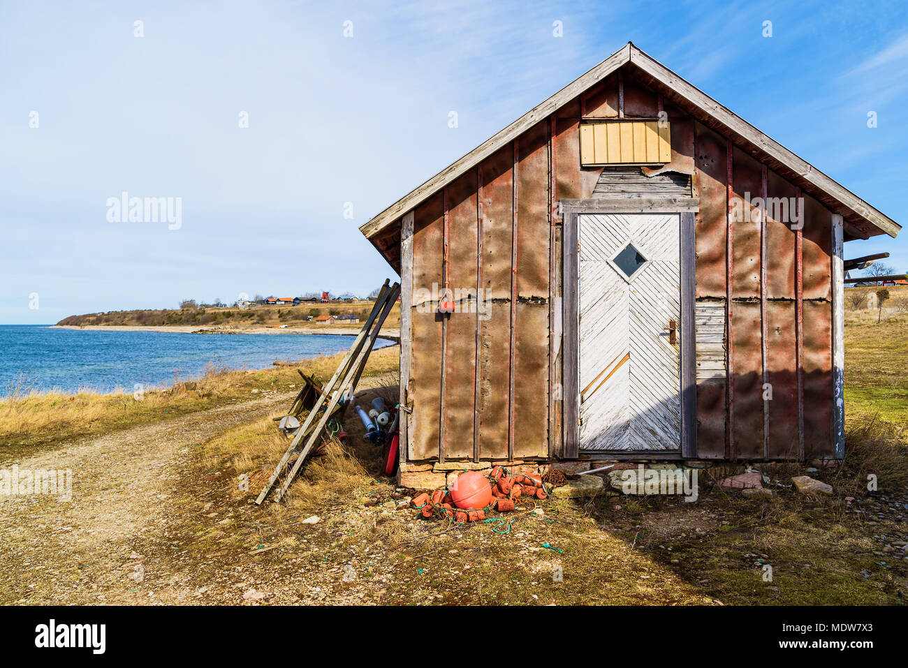 Traditional fishing shed with coastal landscape in background. Location  Aleklinta on Oland, Sweden Stock Photo - Alamy