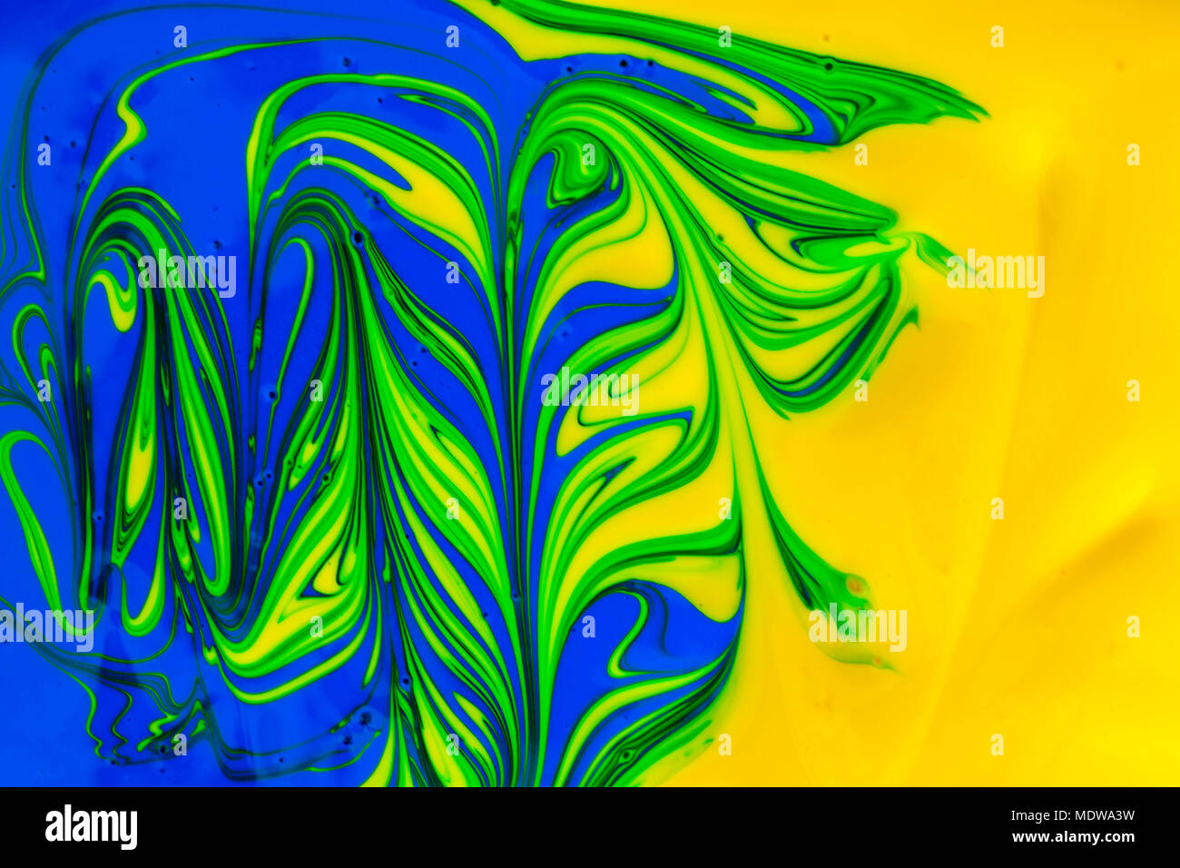 abstract background design in red blue green and yellow paint swirls ...