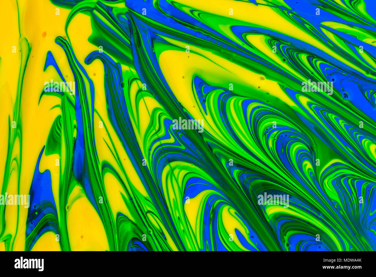 abstract background design in red blue green and yellow paint swirls ...