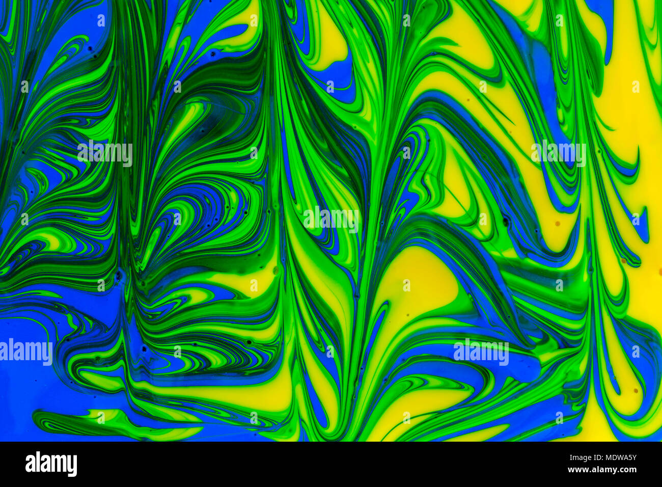 abstract background design in red blue green and yellow paint swirls ...