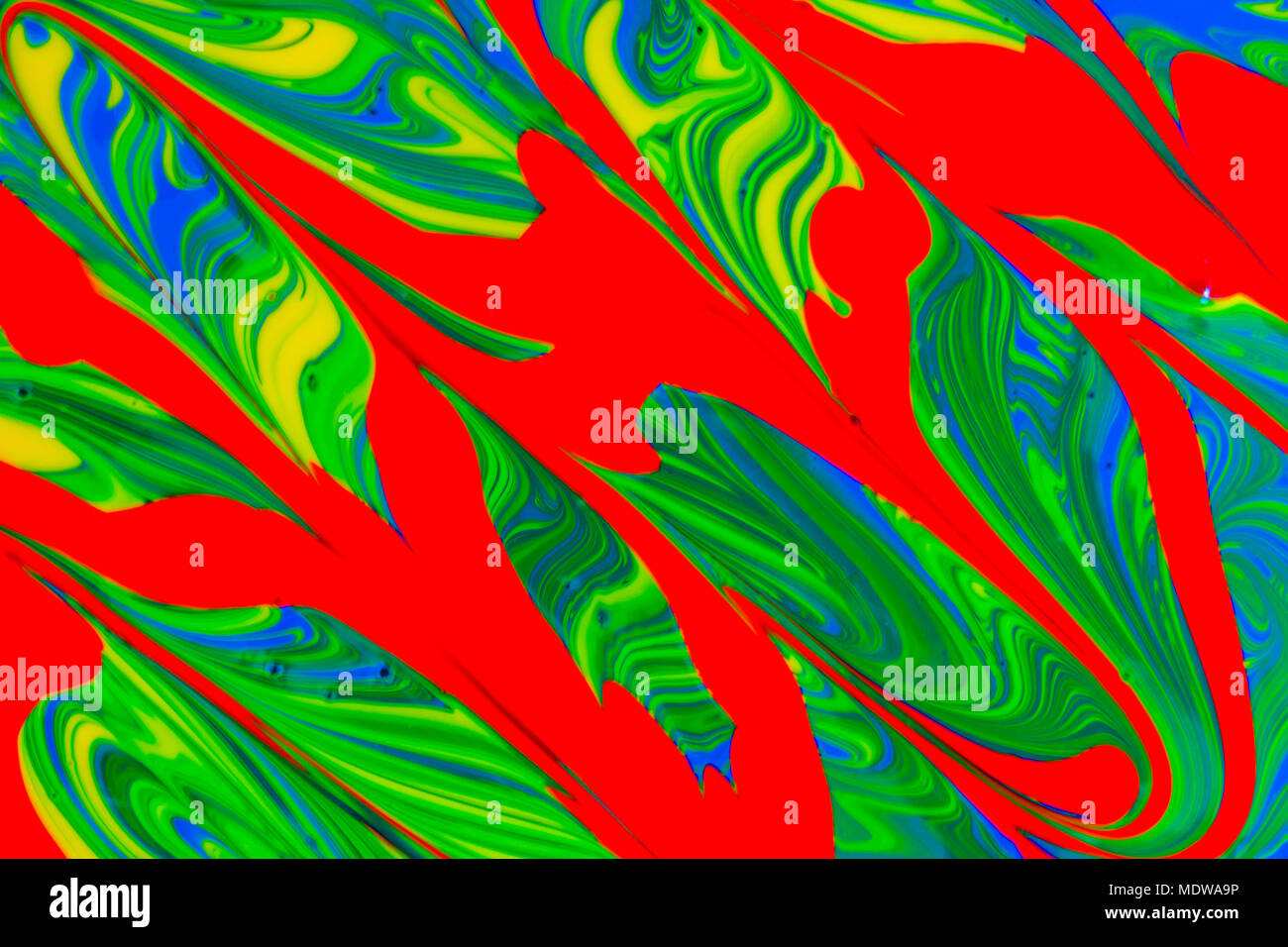 abstract background design in red blue green and yellow paint swirls ...