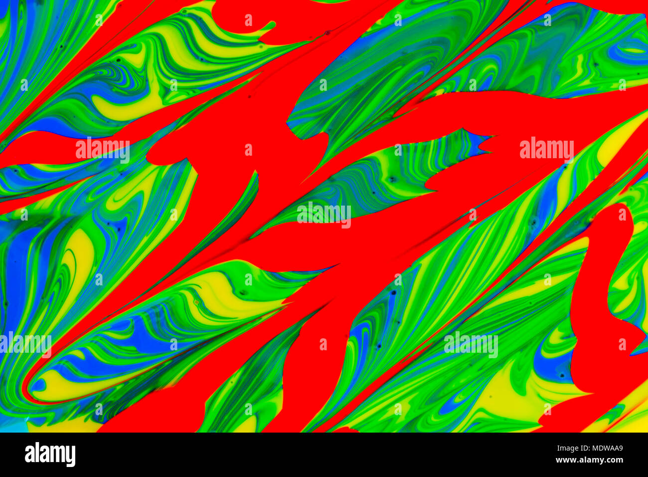abstract background design in red blue green and yellow paint swirls ...