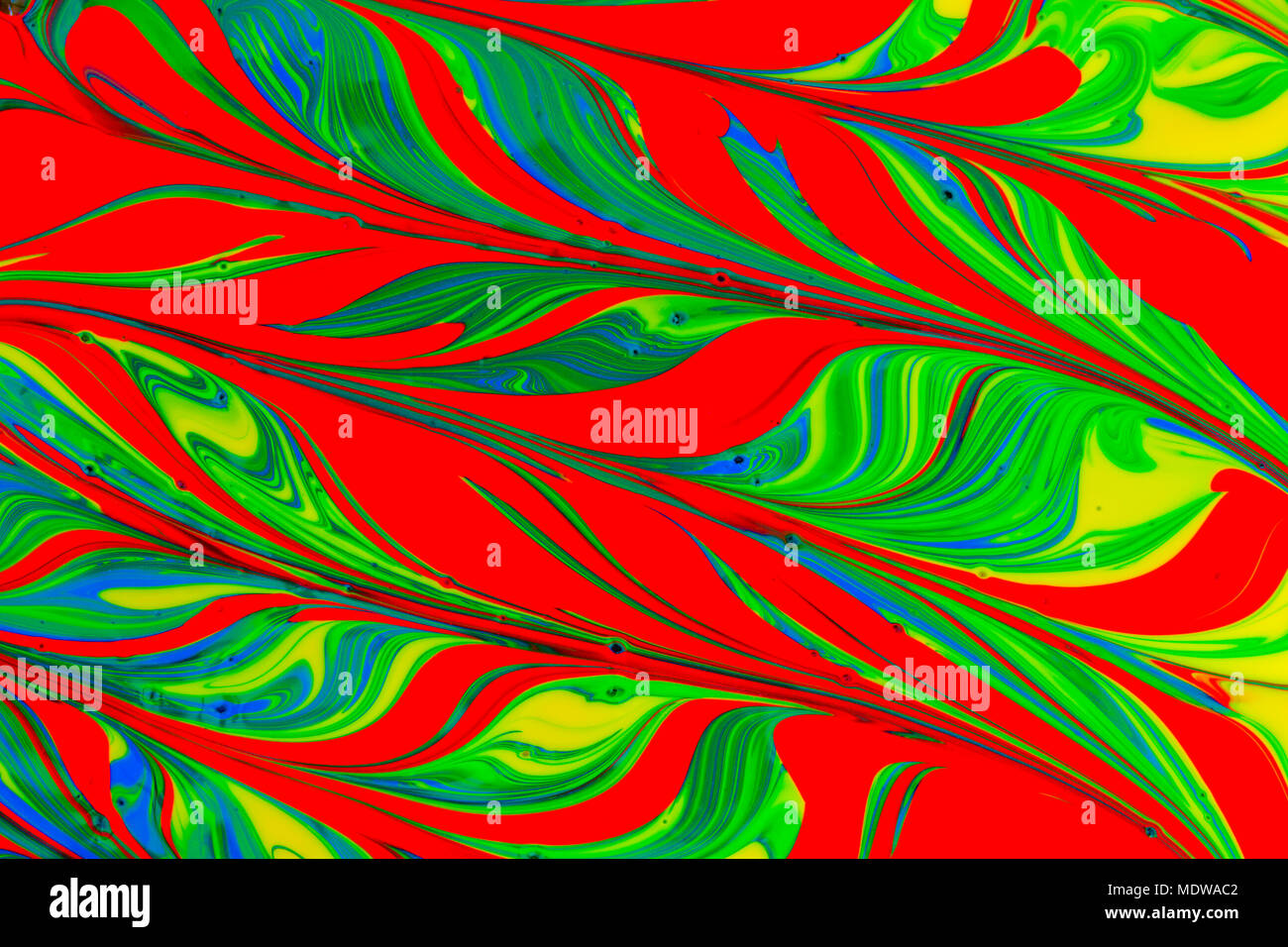 abstract background design in red blue green and yellow paint swirls ...