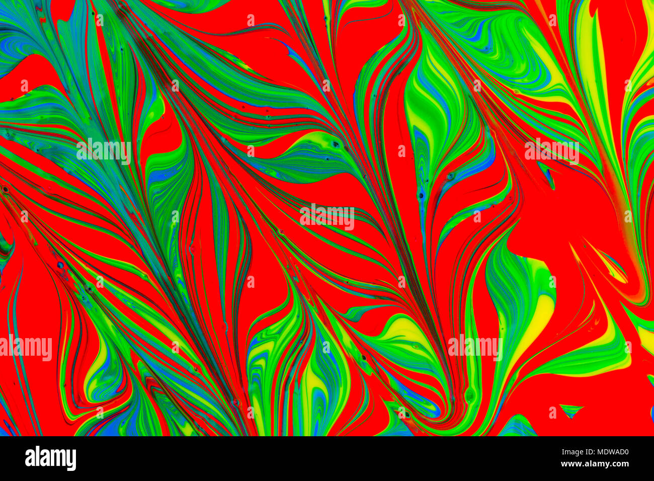 abstract background design in red blue green and yellow paint swirls ...