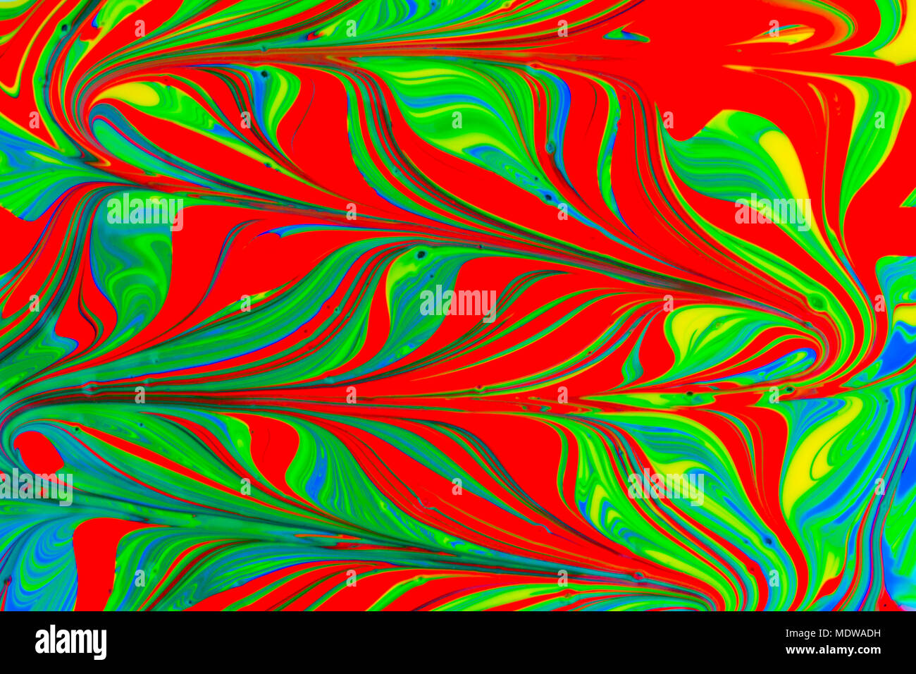 abstract background design in red blue green and yellow paint swirls ...