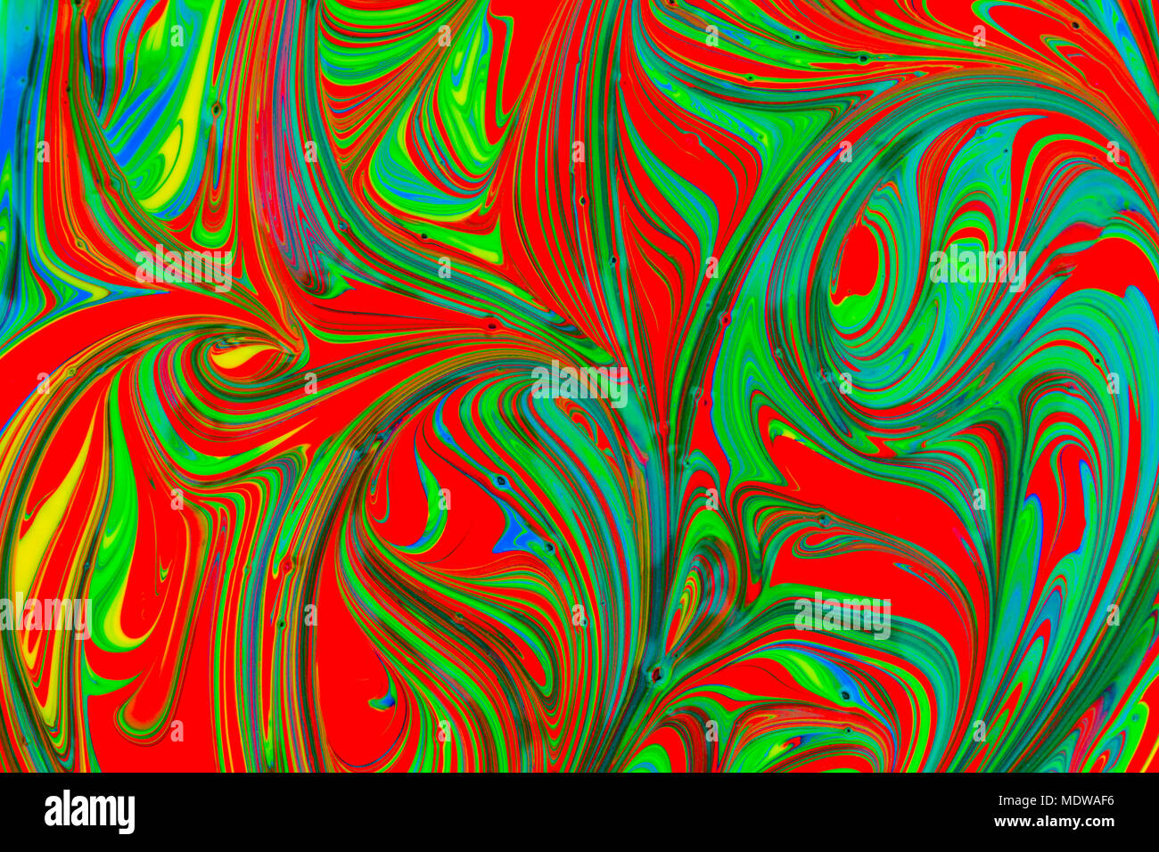 abstract background design in red blue green and yellow paint swirls ...