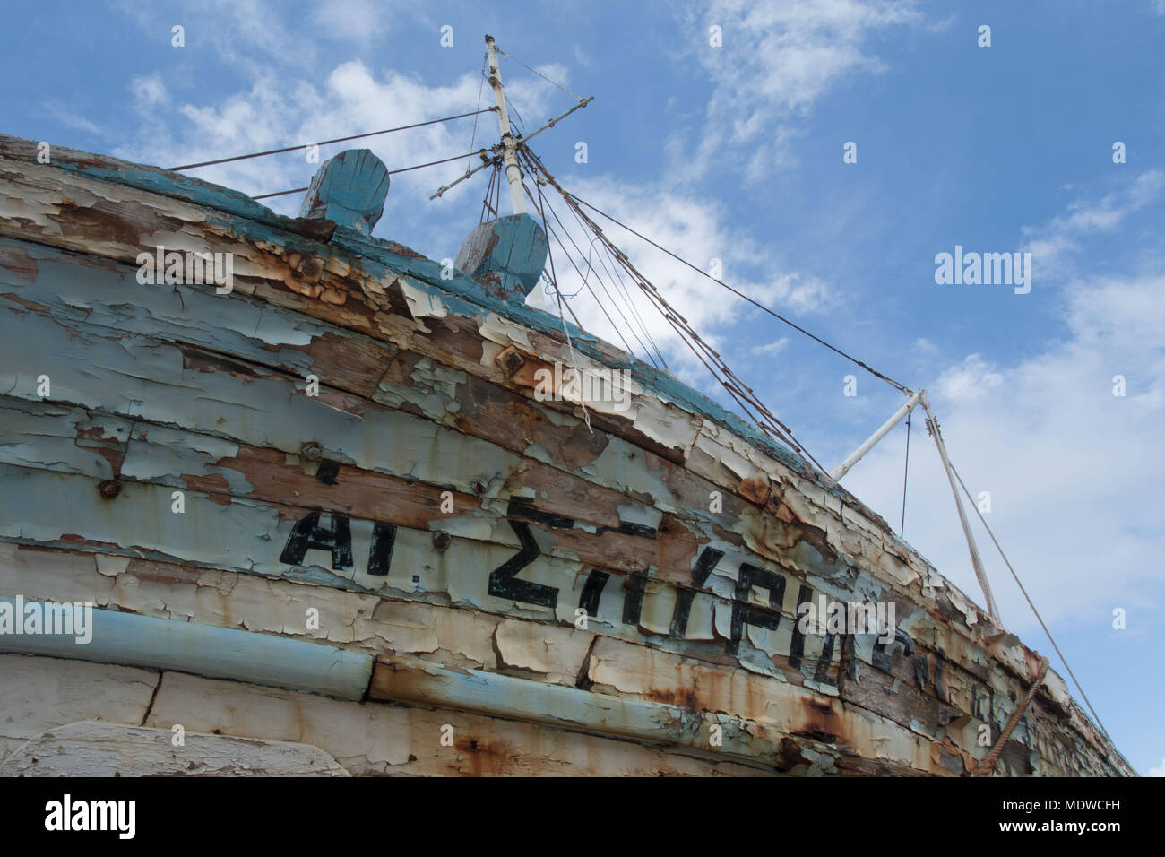 Close up of wooden boat in dry dock showing colourful peeling paint, Polis, Cyprus Stock Photo