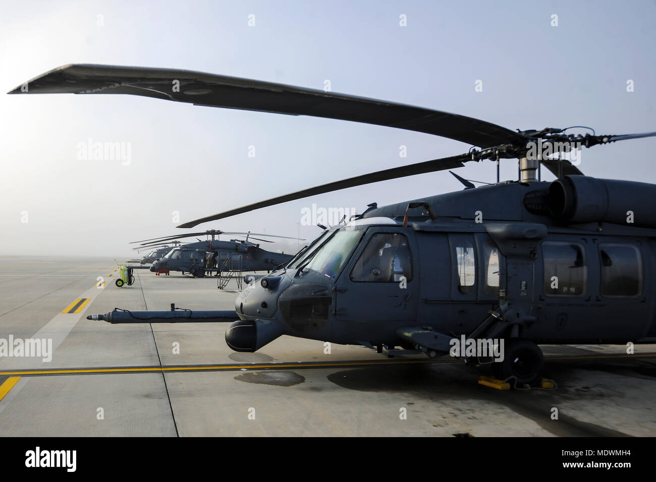 HH-60G Pave Hawk helicopters rest on a flight line, Dec. 5, 2017, at Moody Air Force Base, Ga. As part of a Phase 1, Phase 2 exercise, the 23d Wing is evaluating its operations, maintenance and logistics to determine its readiness to rapidly deploy. Airmen from the 723d Aircraft Maintenance Squadron folded the main and tail rotor blades inward to make it easier to transport and then unfolded the rotors to practice making the helicopter operational.  (U.S. Air Force photo by Airman Eugene Oliver) Stock Photo