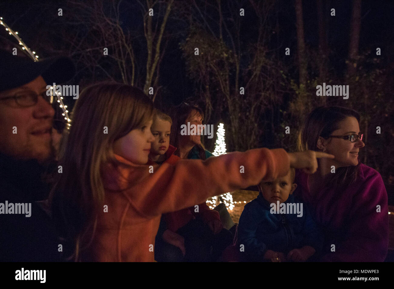The Smith family enjoys the Christmas lights on the hayride at the