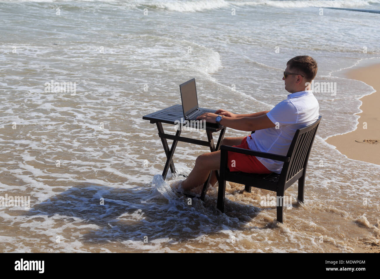 Business Man Working on Tropical Beach Stock Photo - Alamy