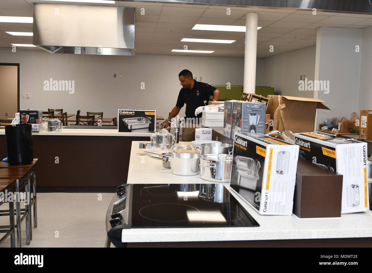 Sgt. 1st Class Raphael B. Bonair, Executive Aide, U.S. Army North (Fifth Army) sets up and prepares the teaching kitchen in the Vogel Resiliency Center. The Vogel Resiliency Center is a project that’s going to bring together eight entities of resiliency services into one location. This facility is unique to fort Sam Houston and unique in the Army. The grand opening of the Vogel Resiliency Center is scheduled for January 5, 2018 at 2p.m., building 367 located at the corner of Stanley and Reynolds. It will be the first military event to kick off the City of San Antonio 300th Anniversary. Stock Photo