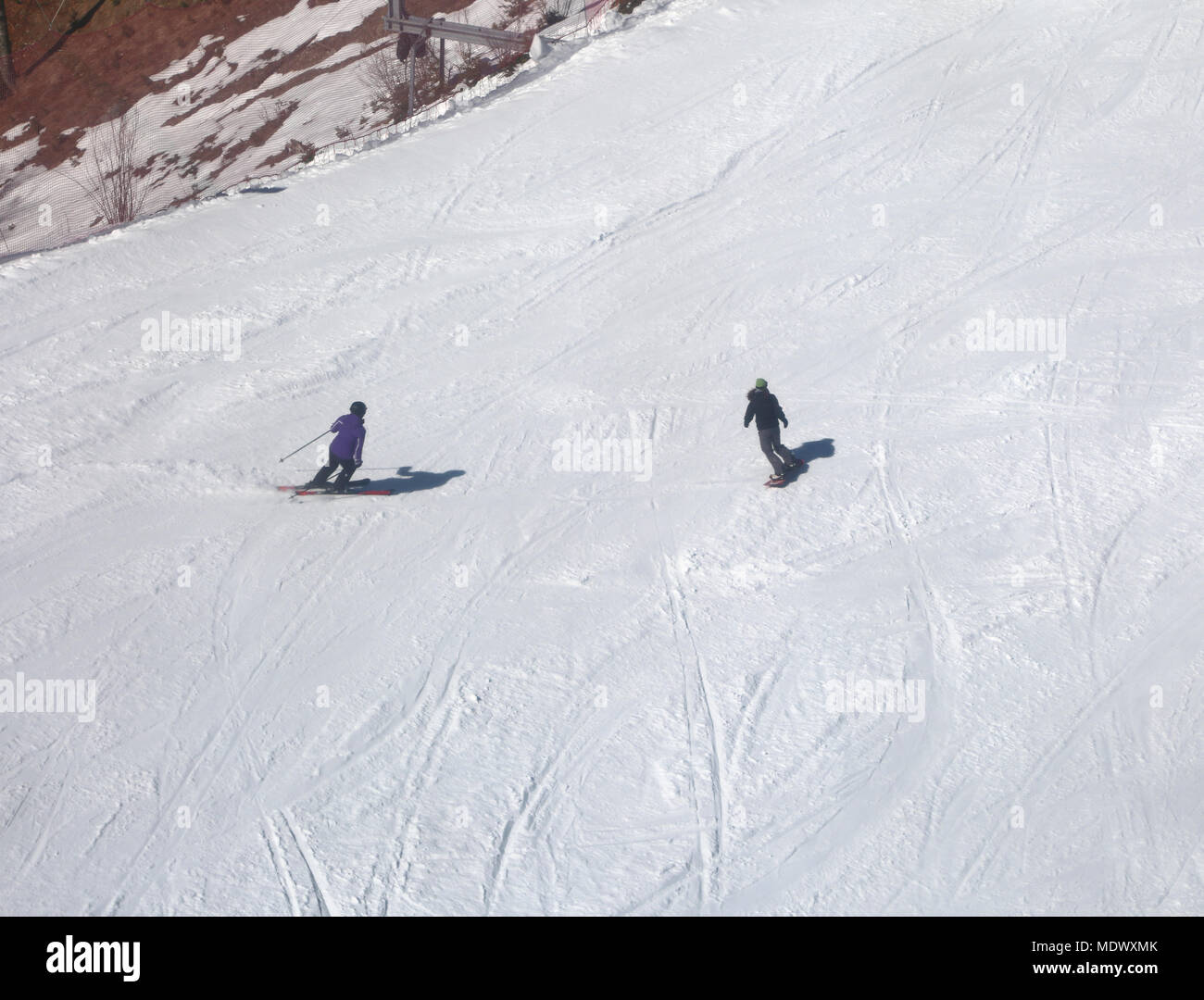 Two skiers in the slope with snow in winter Stock Photo - Alamy