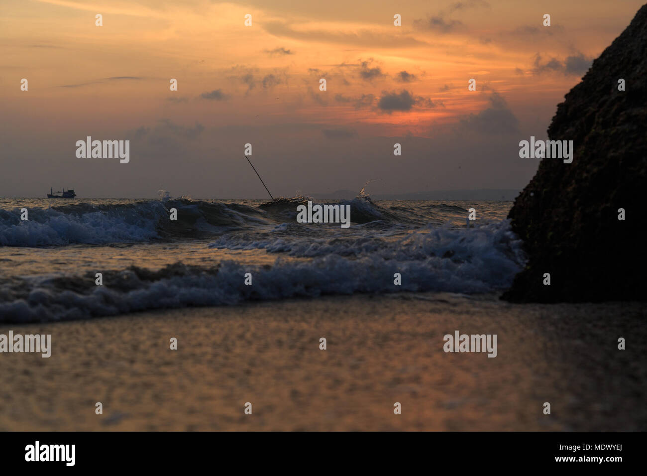 fishing boat to the sea at sunset Stock Photo - Alamy