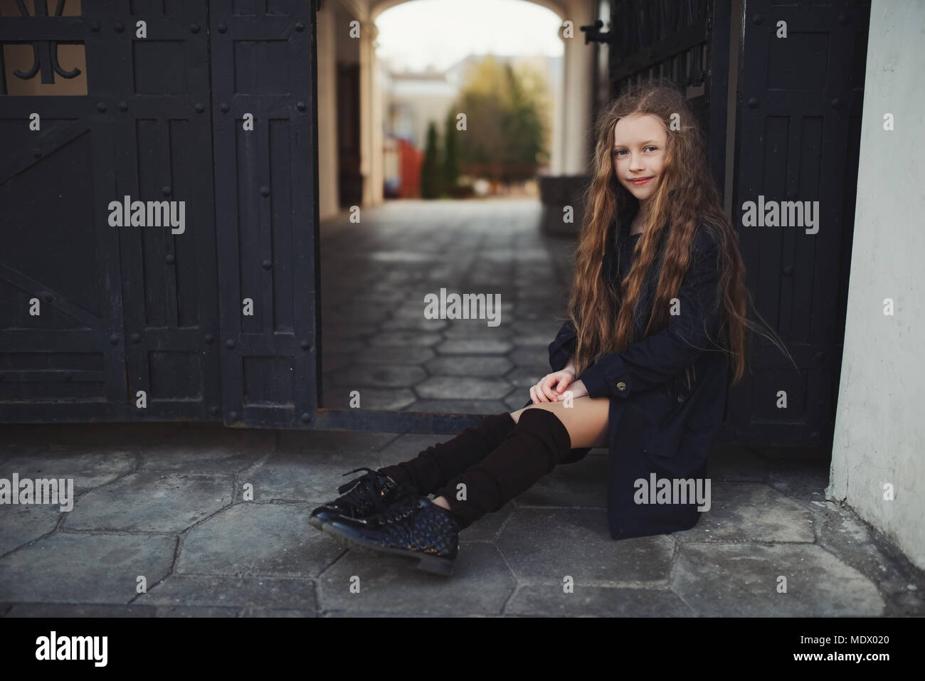 portrait of young girl in black coat Stock Photo - Alamy