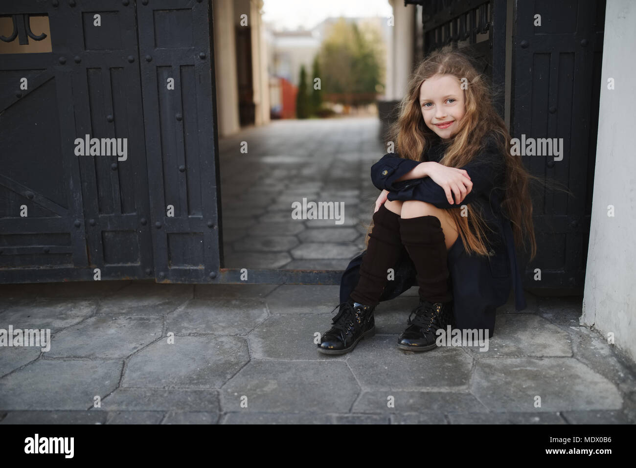 portrait of young girl in black coat Stock Photo - Alamy