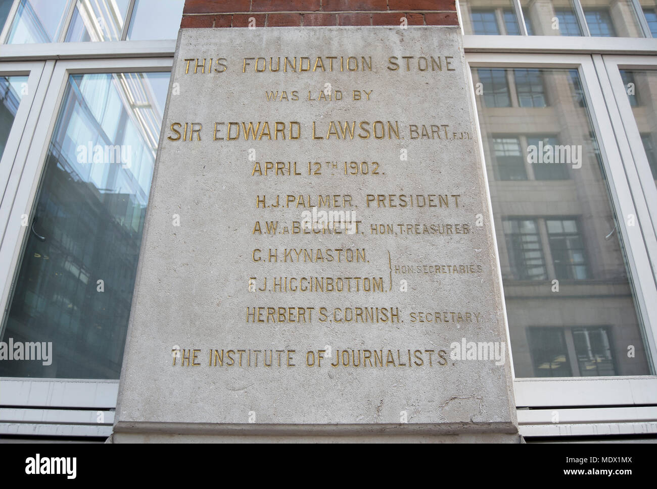 foundation stone laid in 1902 at the institute of journalists building by sir edward lawson, editor of the daily telegraph, london, england Stock Photo