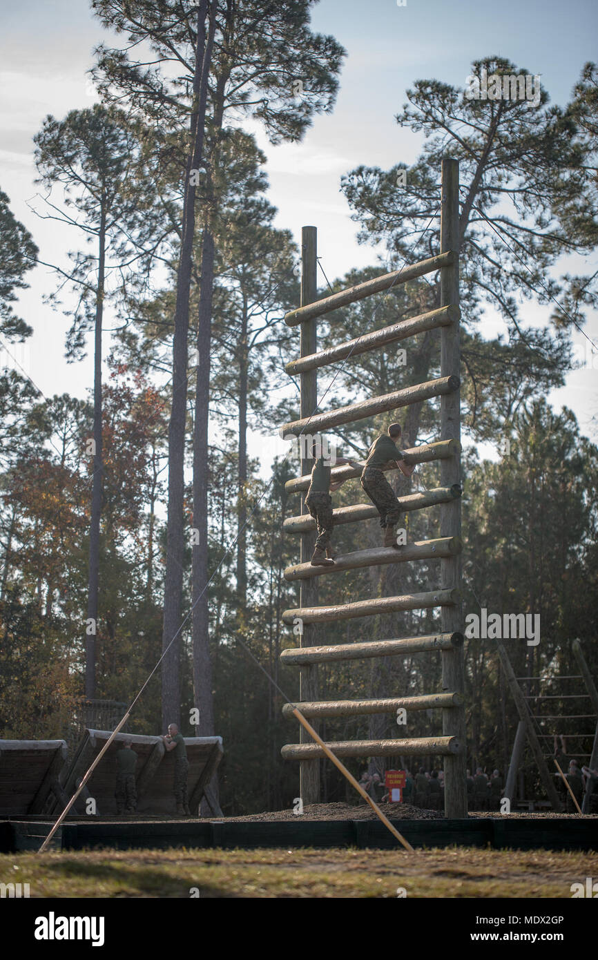 https://c8.alamy.com/comp/MDX2GP/us-marine-corps-recruits-of-lima-3rd-recruit-training-battalion-climb-an-obstacle-on-the-confidence-course-obstacle-dec-04-2017-on-parris-island-sc-the-course-is-comprised-of-15-obstacles-designed-to-help-recruits-build-confidence-by-overcoming-physical-challenges-lima-company-is-scheduled-to-graduate-feb-9-2018-parris-island-has-been-the-site-of-marine-corps-recruit-training-since-nov-1-1915-today-approximately-19000-recruits-come-to-parris-island-annually-for-the-chance-to-become-united-states-marines-by-enduring-12-weeks-of-rigorous-transformative-training-parris-island-MDX2GP.jpg