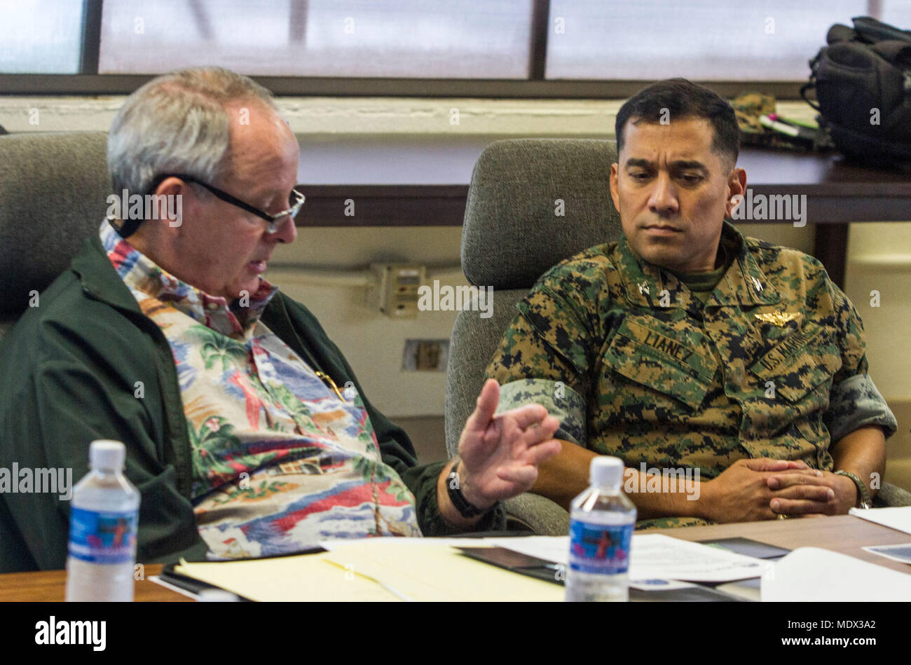 U.S. Marine Corps Col. Raul Lianez, Marine Corps Base Hawaii (MCBH) Commanding Officer, speaks with David Carey, the chairman of the Military Affairs Council of Hawaii (MAC), MCBH, Dec. 13, 2017. Lianez and other base officials met with MAC representatives and discussed present and future issues critical to maintaining a lasting, mutually beneficial relationship with the local Oahu community. (U.S. Marine Corps photo by Lance Cpl. Luke Kuennen) Stock Photo