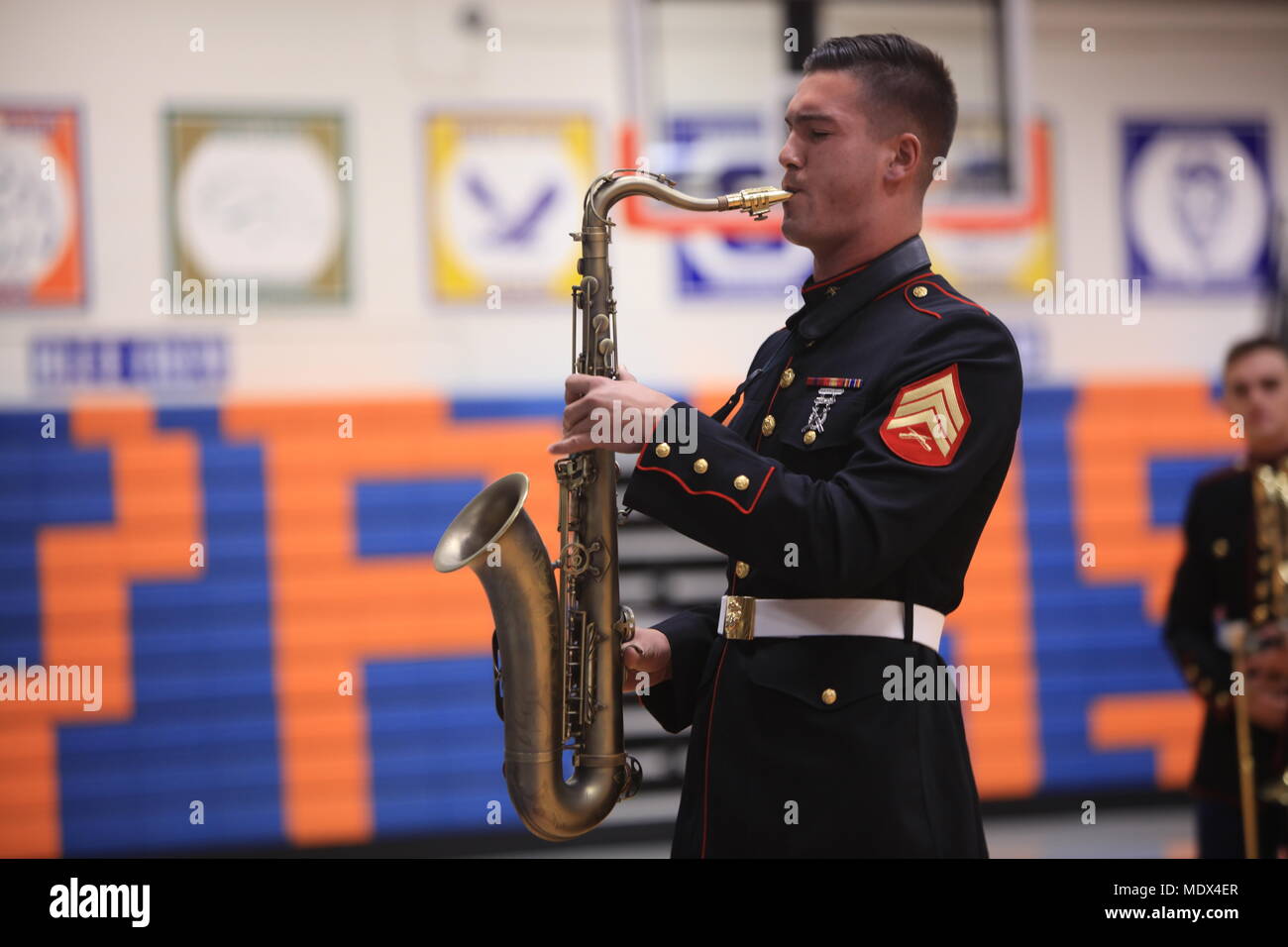 Sergeant Spencer Day plays the saxophone at Valley Park High School, Dec. 14, in Valley Park, Missouri. Marines with the Marine Corps New Orleans Band entertain students and teachers at various high schools in and around the St. Louis area Dec. 12-14 during its winter recruiting tour. Aside from playing music, the New Orleans, Louisiana-based Marines also educated and informed students and teachers about what life is like being a band Marine. (Official U.S. Marine Corps photo by GySgt. Bryan A. Peterson/Released) Stock Photo