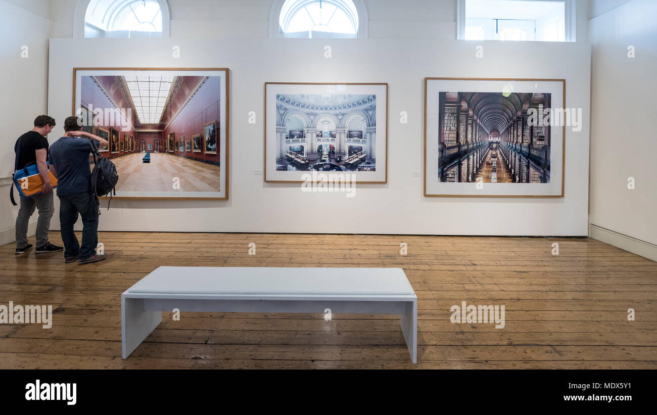London, UK. 20 April 2018. Visitors view images by Candida Höfer  (Outstanding Contribution to Photography) at the 2018 Sony World  Photography Awards Exhibition at Somerset House. The 11th edition of the  competition