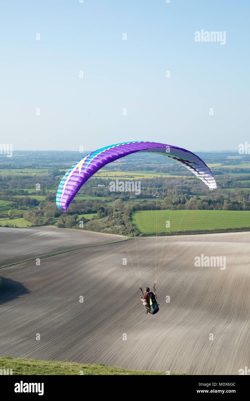 Soaring with the Red Kites, a member of Thames Valley Hang-gliding Club launched from Combe Gibbet and flying over the Berkshire countryside Credit: James Wadham / Alamy Live News Stock Photo