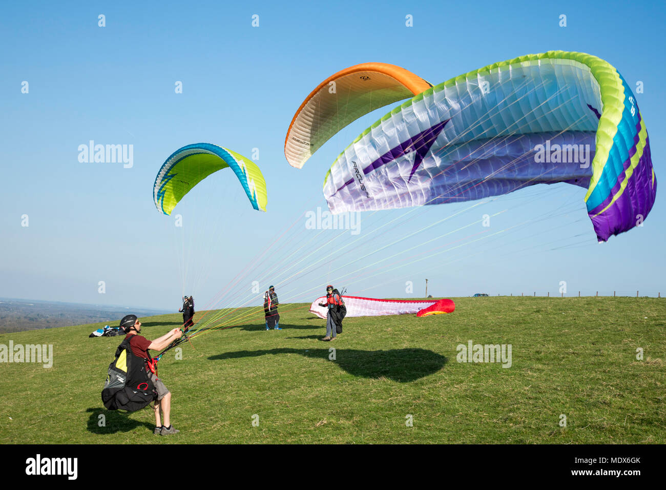 Waiting to fly, members of Thames Valley Hang-gliding Club on Combe Gibbet near Hungerford waiting for the perfect conditions to launch Credit: James Wadham / Alamy Live News Stock Photo