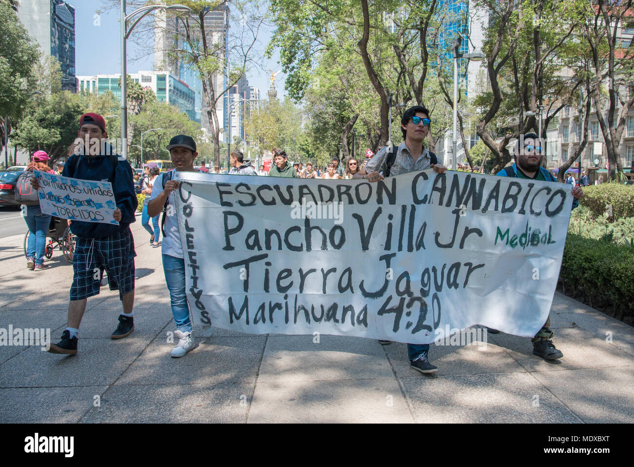 Mexico City, Mexico. 20th April, 2018.  More than a hundred people gathered in Mexico City's main avenue Paseo de la Reforma to rally in favor of the legalization of marijuana in Mexico City. The main banner reads 'Cannabic Squad Pancho Villa Jr.' The banner on the left reads 'United stoners will never be busted'. Credit: Miguel A. Aguilar-Mancera/Alamy Live News Stock Photo