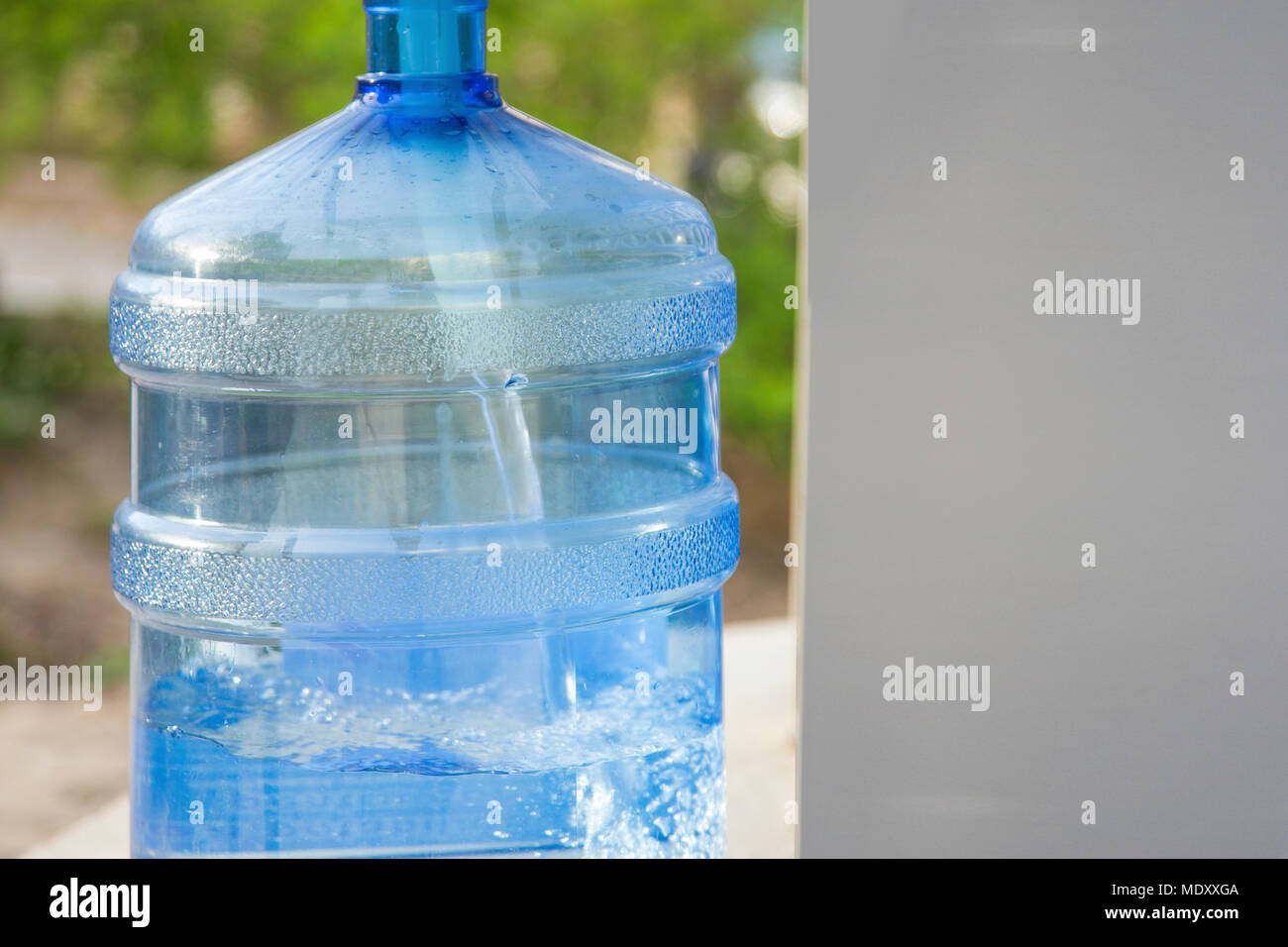Water Gallon Refill Vending Station filling with water in a special