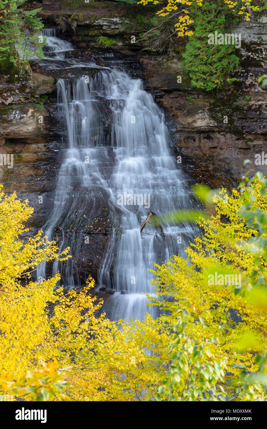 Chapel Falls at Pictured Rocks National Lakeshore, is framed by warm autumn colors in the Upper Peninsula of Michigan Stock Photo
