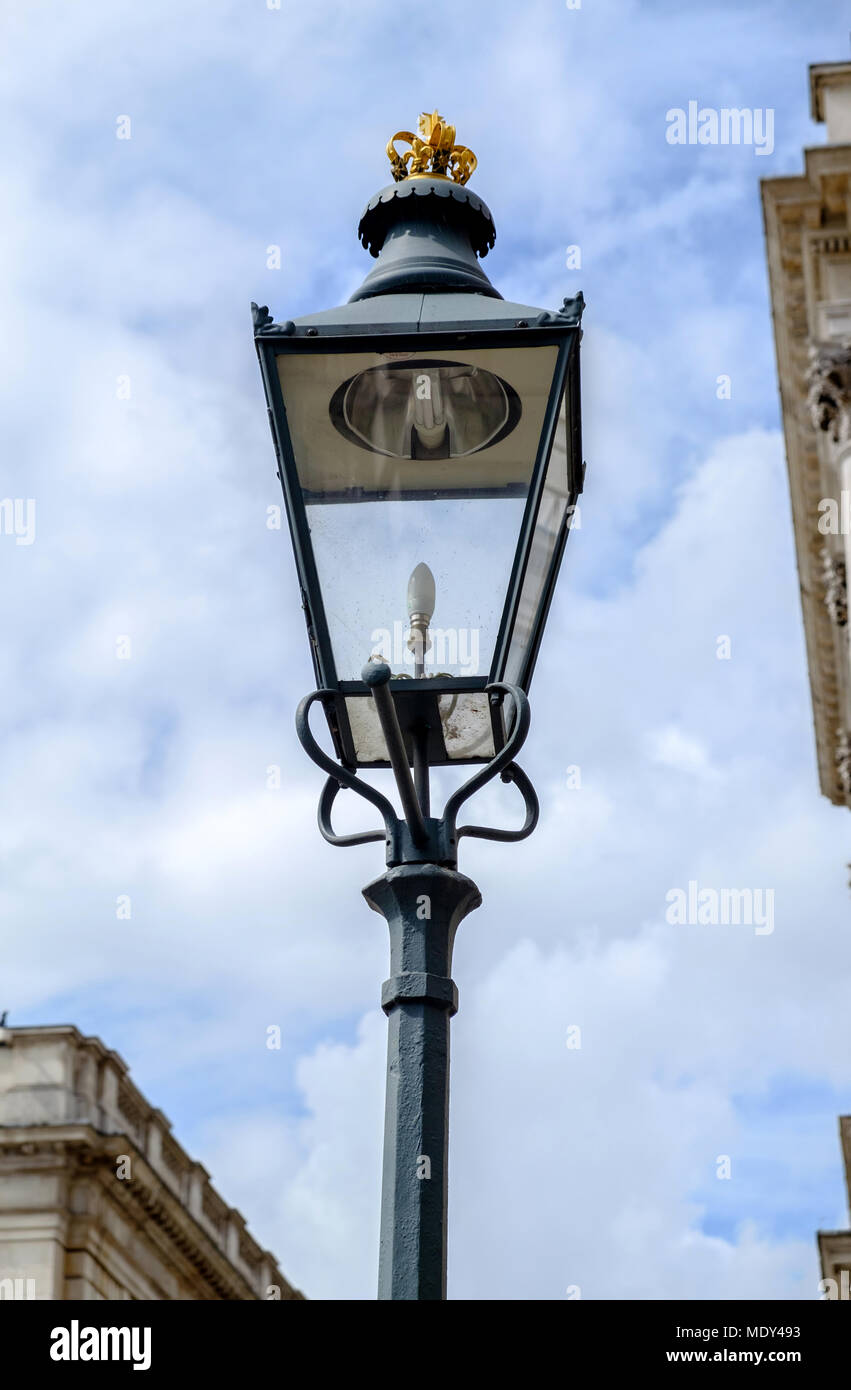 Old wrought iron lamp post with gold trim on top outside Somerset House,  The Strand, London. Portrait. Close up Stock Photo - Alamy