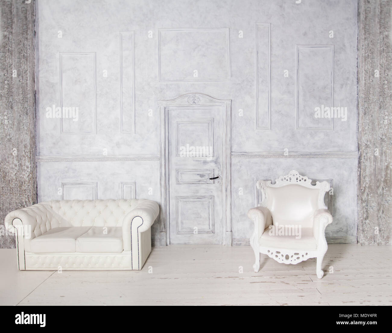 Vintage Interior With Sofa Armchair Stucco Wall And Door