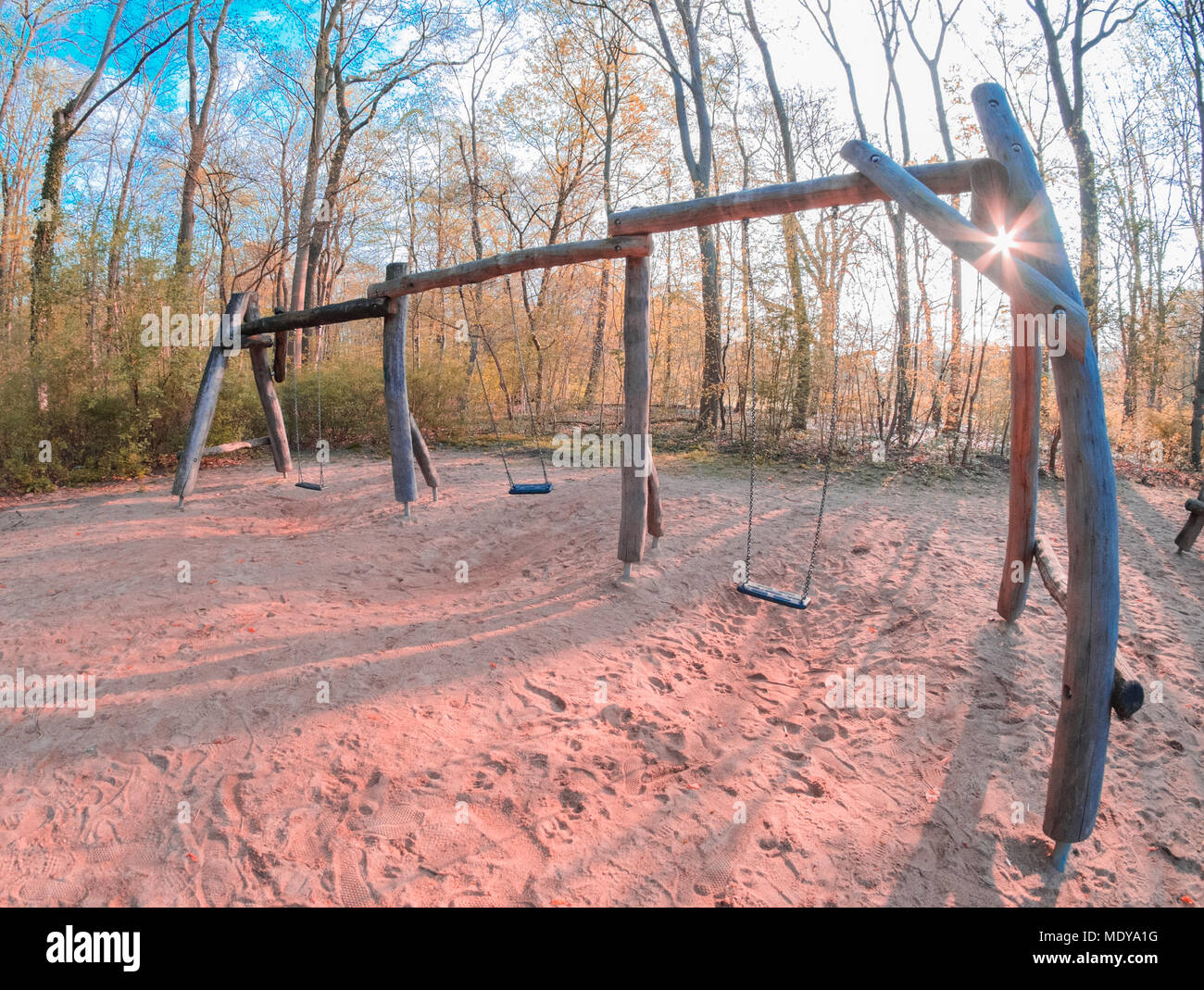 Three swings on a playground in Köln Lindenthal Stock Photo