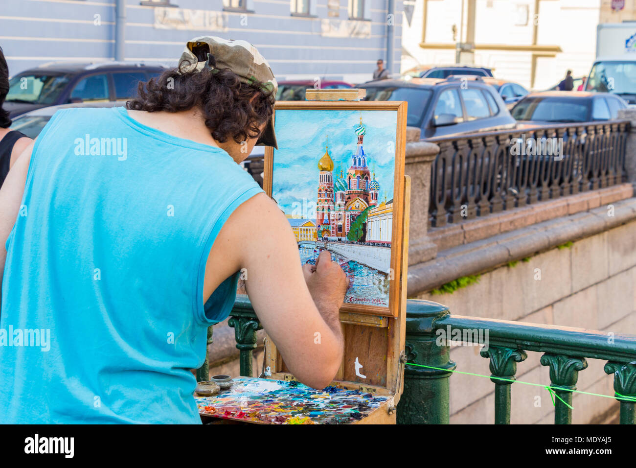 Saint-Petersburg, Russia - July 27, 2016: The artist paints the temple of the Savior on the Blood Stock Photo