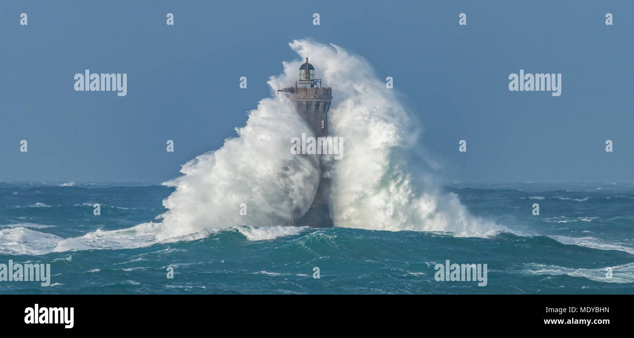 Huge Wave at a lighthouse Stock Photo
