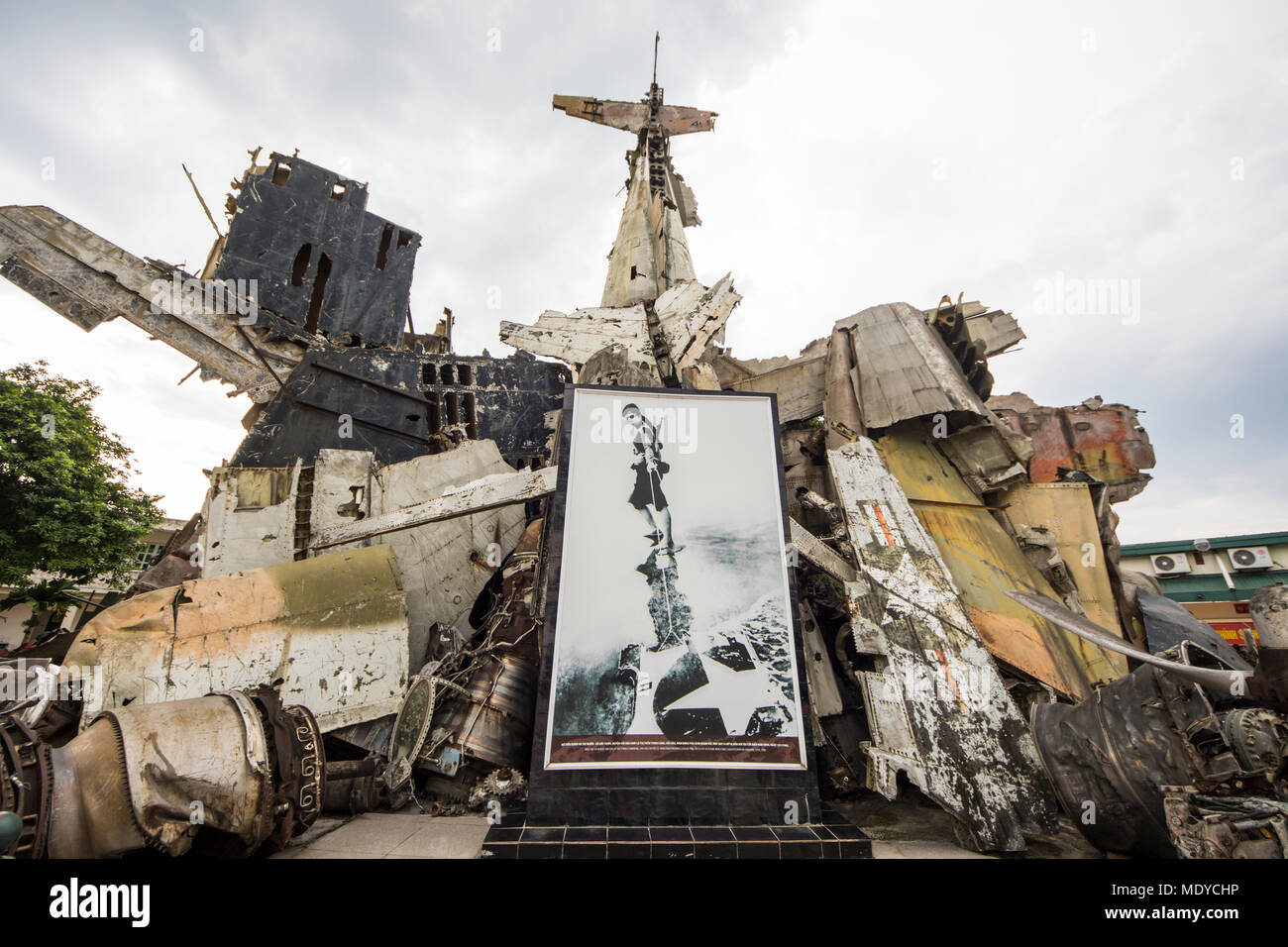 Picture of a female fighter in the aircraft wreckage sculpture on display at the Vietnam Military History Museum; Hanoi, Vietnam Stock Photo